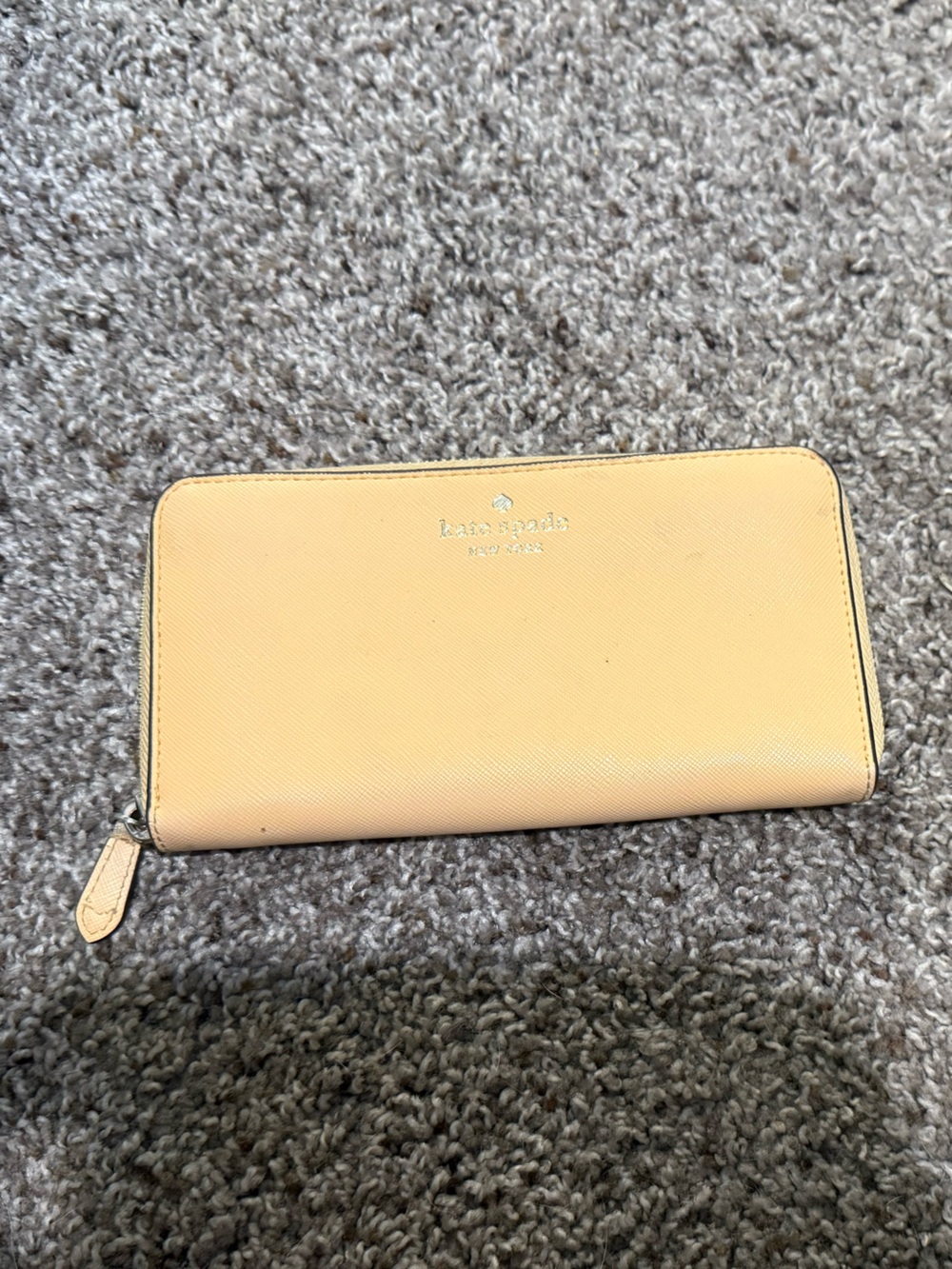 kate spade pale yellow zip-around wallet